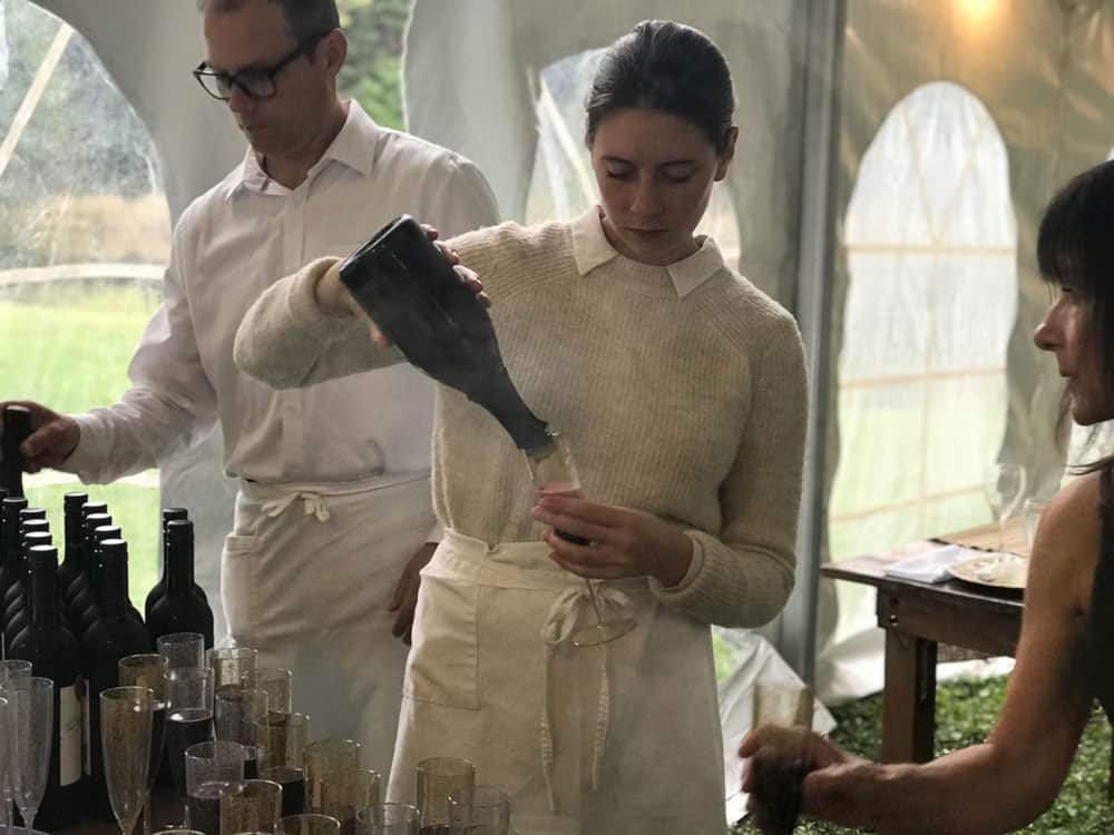 Caterers pouring wine