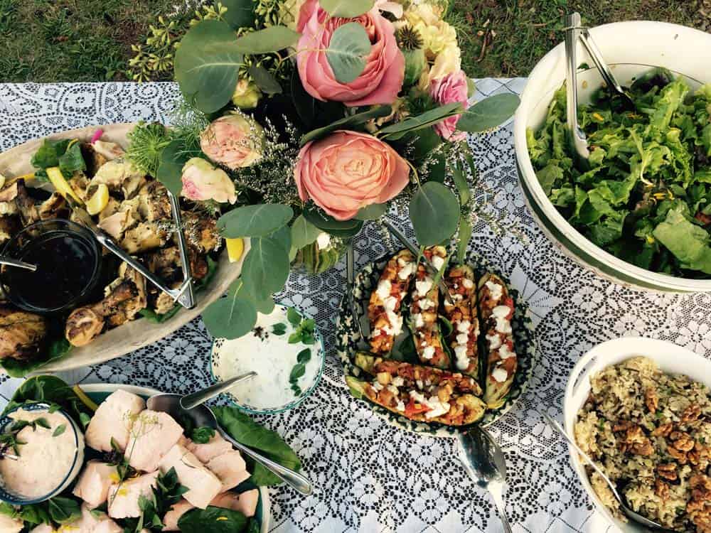 Table setting with many dishes and a bouquet