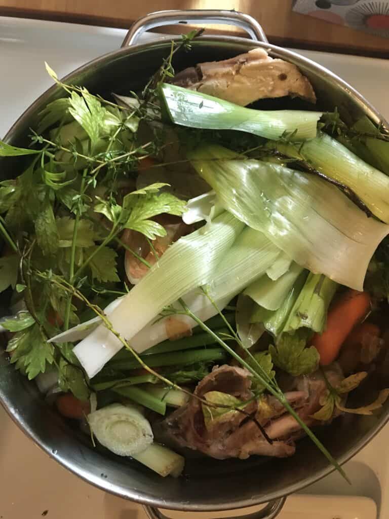 vegetables and herbs in pot 
