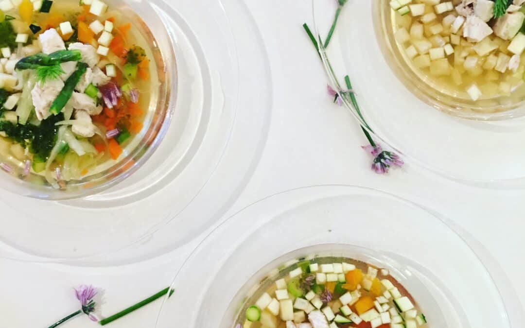 Bowls of clear vegetable soup